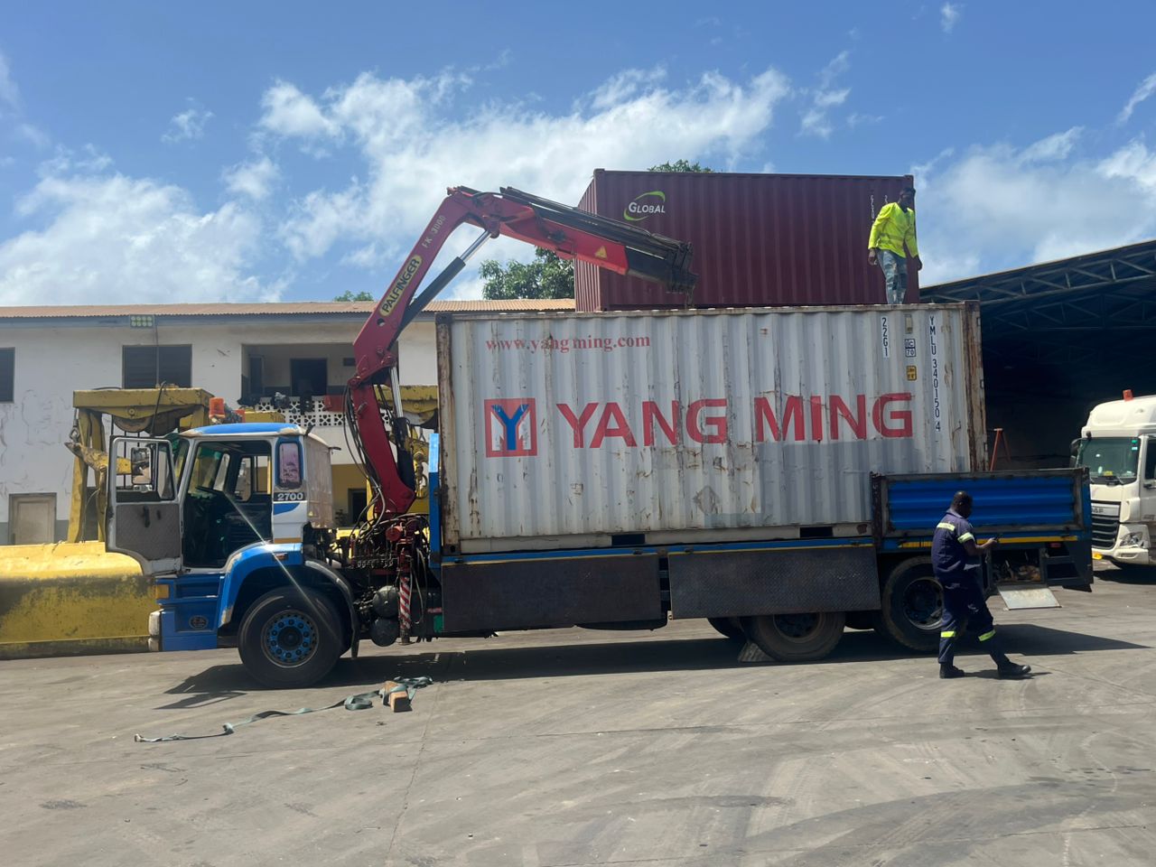 Container being loaded onto truck